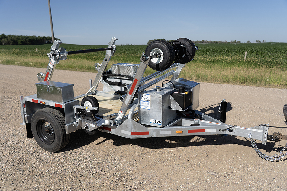 A perspective from slightly above, showing the LCT-5620 trencher on a road.