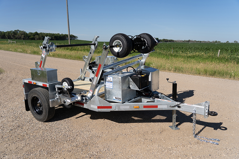 LCT-5620 trencher on a road, with a grassy area visible next to it.