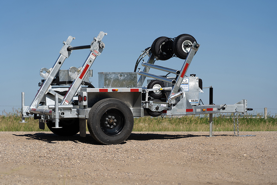 Side view of the LCT-5620 trencher on a road.